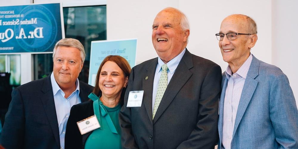 Bob Rhodes, Dr. Quinton White, Dr. Susan White, and President Tim Cost